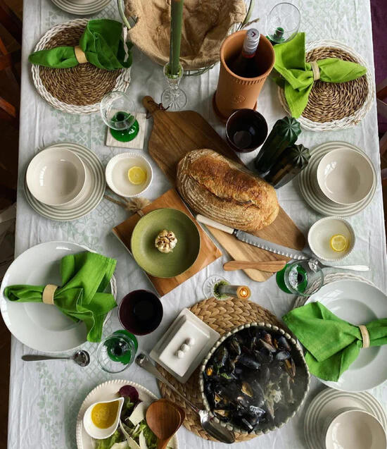 A table of homemade food with fresh bread